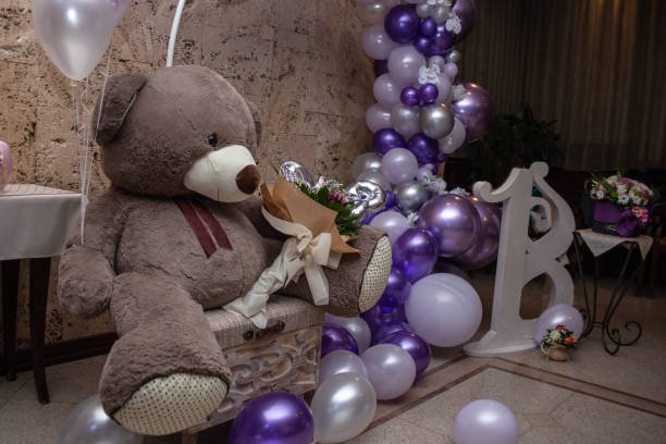 Balloon decoration with huge teddy bear and bouquet